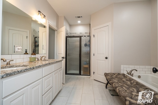 bathroom with vanity and plus walk in shower