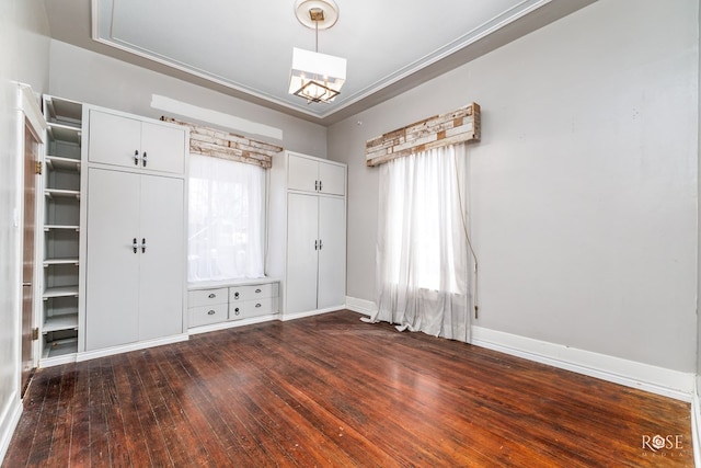 interior space featuring crown molding and dark hardwood / wood-style floors