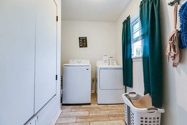 washroom with washer and dryer