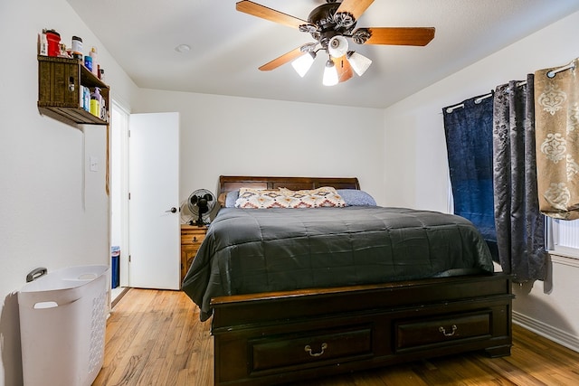 bedroom featuring ceiling fan and light hardwood / wood-style flooring