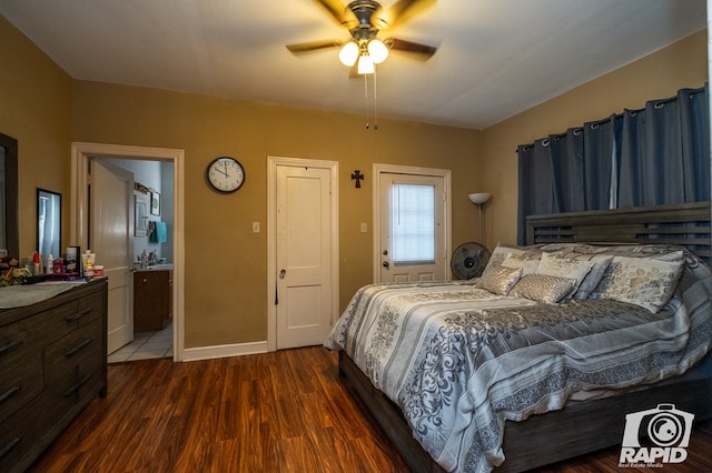 bedroom featuring ensuite bathroom, dark wood-type flooring, and ceiling fan