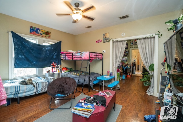 bedroom featuring ceiling fan and dark hardwood / wood-style flooring