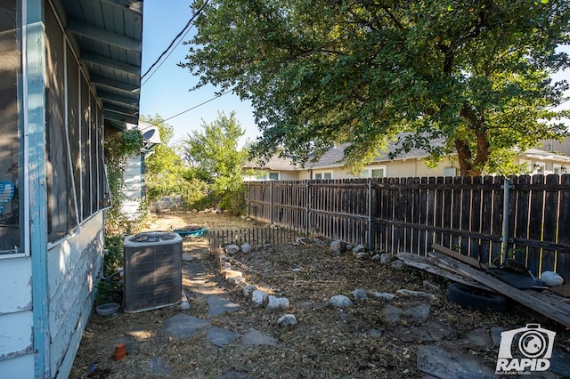 view of yard with central AC unit