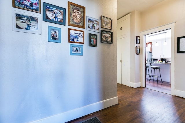 hallway featuring dark hardwood / wood-style floors