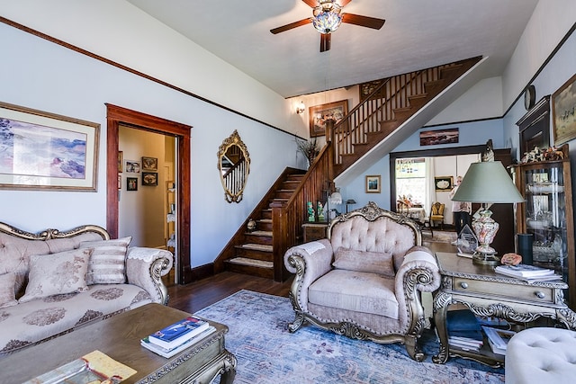 living room featuring dark wood-type flooring and ceiling fan