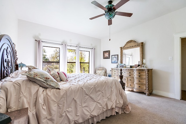 bedroom with ceiling fan and carpet floors