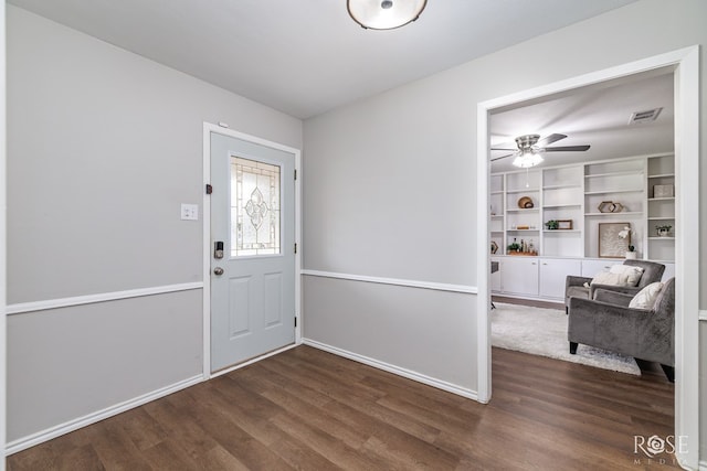 3102 Chatterton Dr, San Angelo, TX 76904 - entryway with dark wood-style floors, visible vents, a ceiling fan, and baseboards