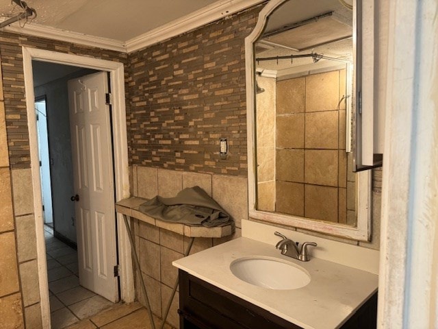 445 8th St, San Angelo, TX 76901 - bathroom with ornamental molding, vanity, and tile patterned floors