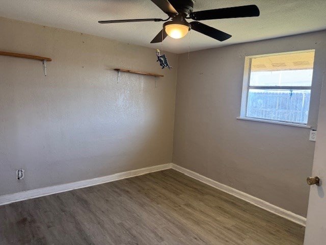 445 8th St, San Angelo, TX 76901 - unfurnished room with wood finished floors, a ceiling fan, and baseboards