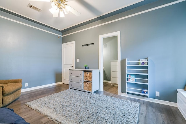 1001 Avondale Ave, San Angelo, TX 76901 - bedroom with wood finished floors, baseboards, and crown molding