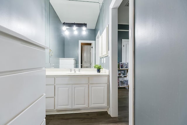 1001 Avondale Ave, San Angelo, TX 76901 - bathroom featuring wood finished floors and vanity