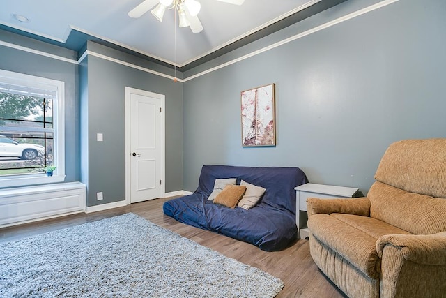 1001 Avondale Ave, San Angelo, TX 76901 - living area featuring ornamental molding, wood finished floors, a ceiling fan, and baseboards
