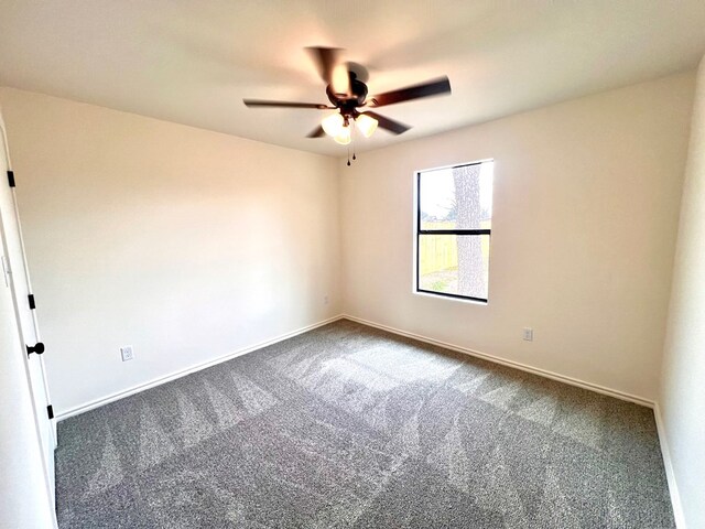 309 E 25th St, San Angelo, TX 76903 - empty room with carpet floors and a ceiling fan
