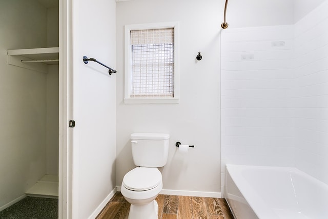 bathroom featuring hardwood / wood-style flooring and toilet