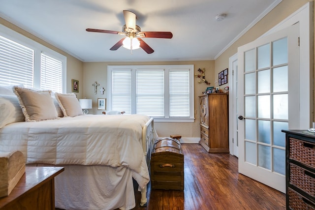 bedroom with crown molding, ceiling fan, and dark hardwood / wood-style floors