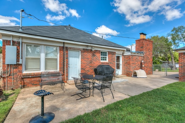 rear view of property featuring a patio