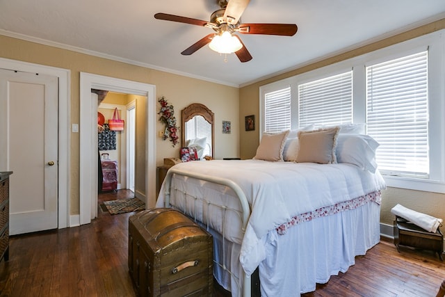 bedroom featuring ornamental molding, dark hardwood / wood-style floors, and ceiling fan