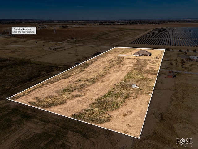 birds eye view of property featuring a rural view