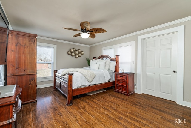 bedroom with a ceiling fan, baseboards, dark wood-type flooring, and crown molding