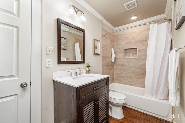 bathroom featuring toilet, wood finished floors, visible vents, ornamental molding, and shower / bath combo with shower curtain