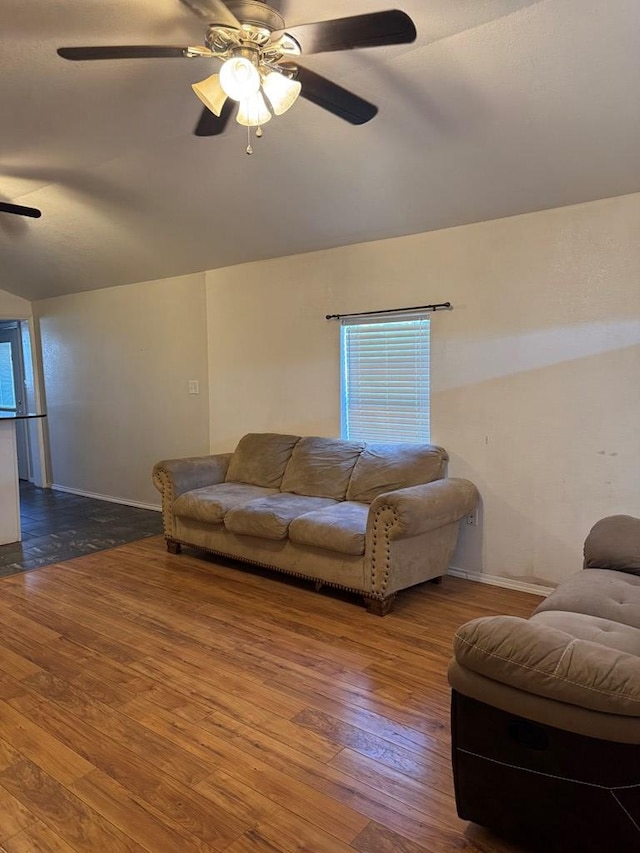 living room with vaulted ceiling, hardwood / wood-style floors, and ceiling fan