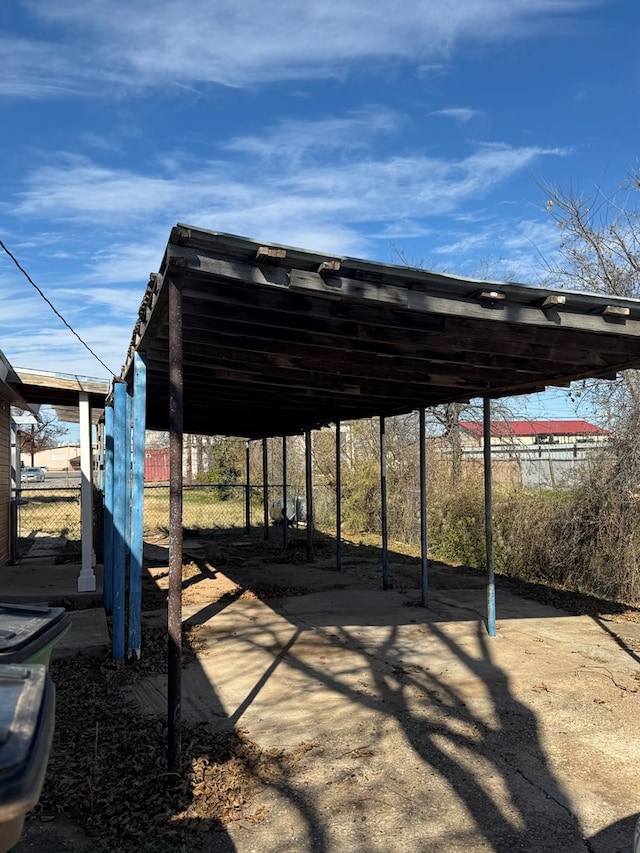 view of parking / parking lot with a carport