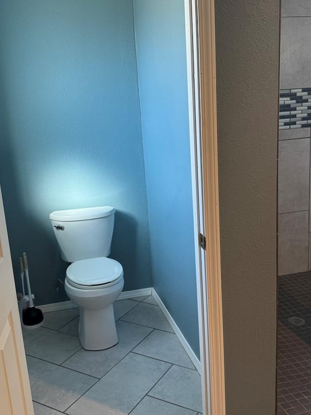 bathroom featuring tile patterned floors and toilet