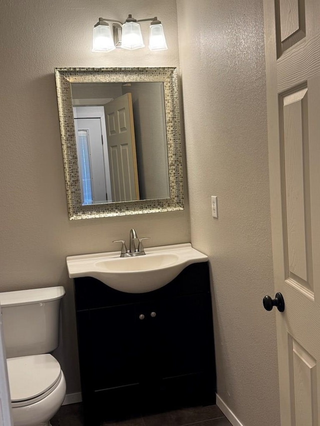 bathroom with vanity and toilet