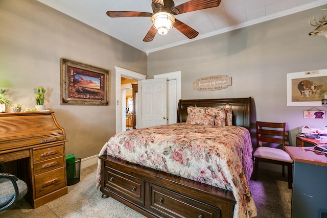 carpeted bedroom featuring ornamental molding and ceiling fan