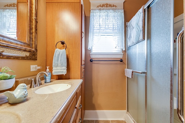 bathroom with vanity and tile patterned floors