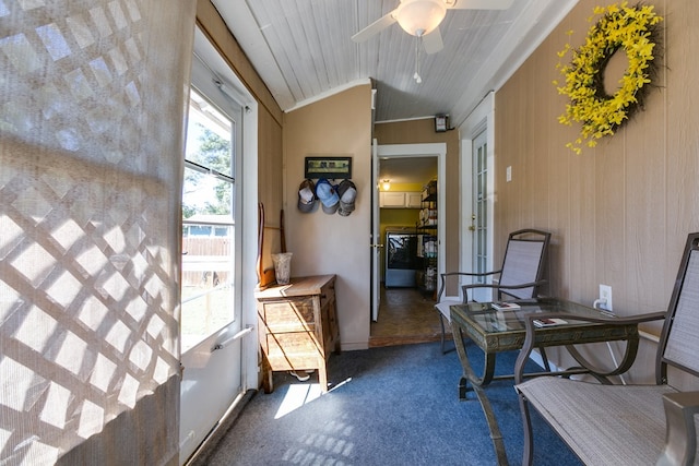 interior space with lofted ceiling, wooden ceiling, and ceiling fan