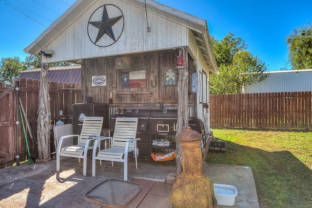 view of patio / terrace featuring an outbuilding