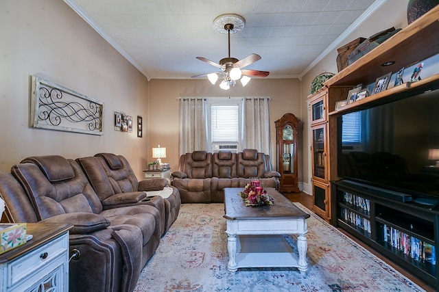 living room featuring crown molding and ceiling fan