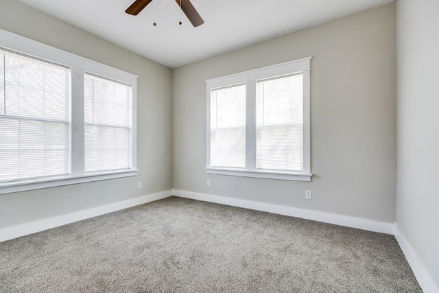 empty room with carpet flooring and ceiling fan