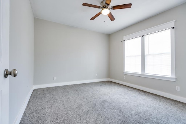 unfurnished room with ceiling fan and carpet floors