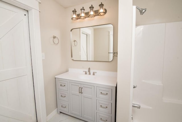 bathroom with walk in shower and vanity