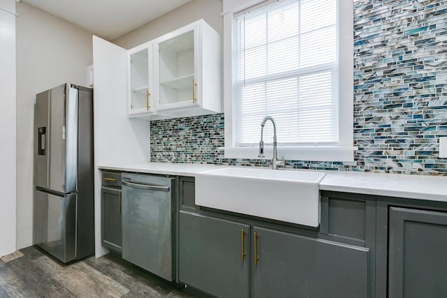 kitchen featuring white cabinetry, sink, stainless steel appliances, and gray cabinetry