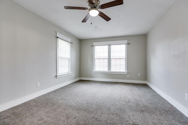 spare room featuring carpet and ceiling fan