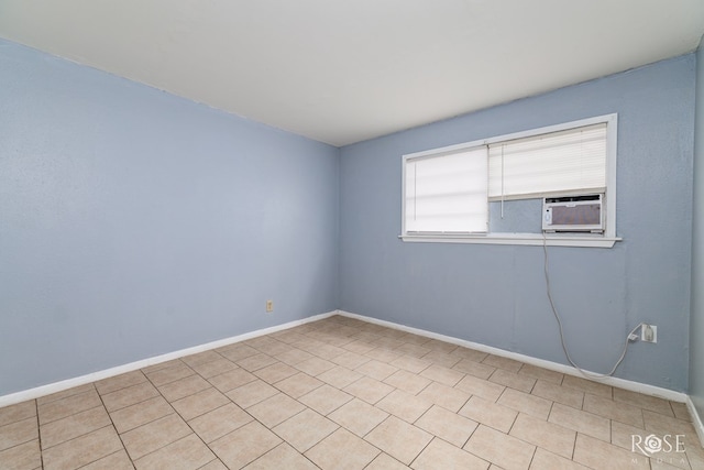 323 E 6th St, San Angelo, TX 76903 - unfurnished room featuring cooling unit and baseboards