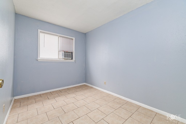323 E 6th St, San Angelo, TX 76903 - spare room with cooling unit and baseboards