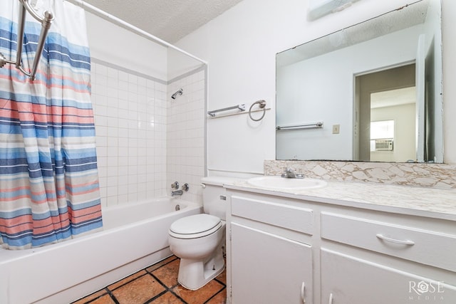323 E 6th St, San Angelo, TX 76903 - bathroom featuring shower / tub combo with curtain, tile patterned floors, toilet, vanity, and a textured ceiling