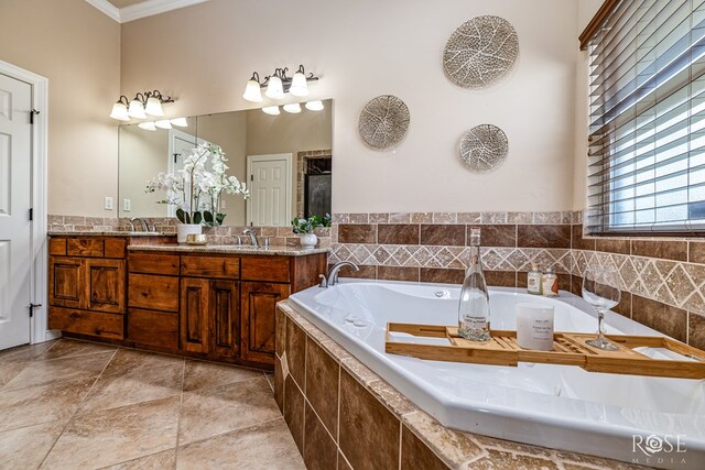 7738 Bison Trl, San Angelo, TX 76901 - bathroom with ornamental molding, double vanity, and a bath