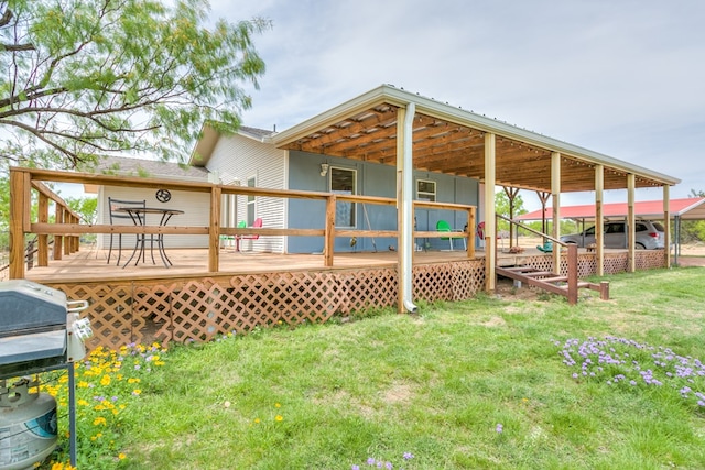 back of property featuring a lawn and a deck