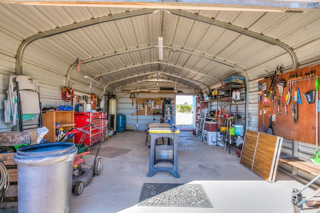 garage with metal wall and a workshop area