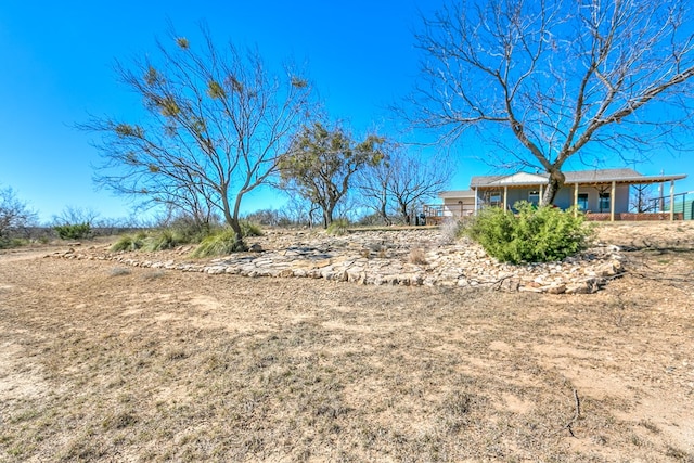 view of yard with a porch