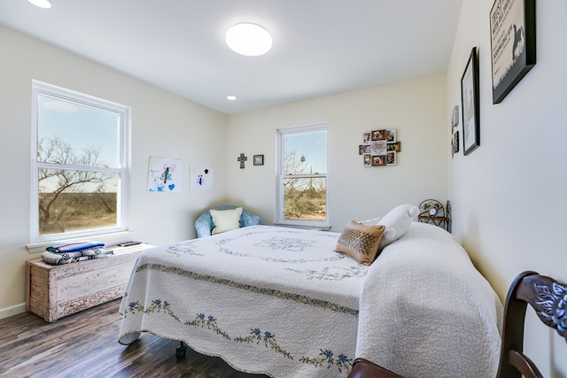 bedroom with recessed lighting, baseboards, and wood finished floors