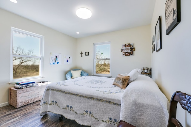 bedroom featuring recessed lighting, wood finished floors, and baseboards
