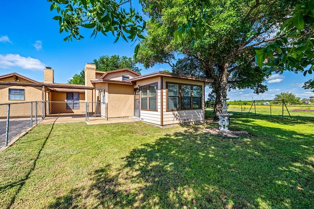 8881 Rust Rd, San Angelo, TX 76905 - rear view of property featuring stucco siding and a chimney