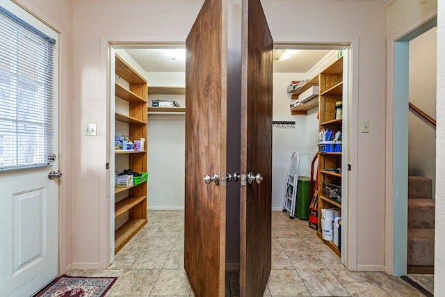 8881 Rust Rd, San Angelo, TX 76905 - walk in closet with light tile patterned floors