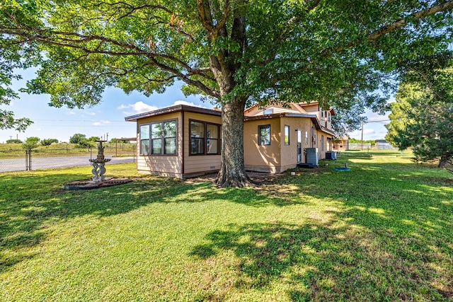 8881 Rust Rd, San Angelo, TX 76905 - back of house with stucco siding and central air condition unit